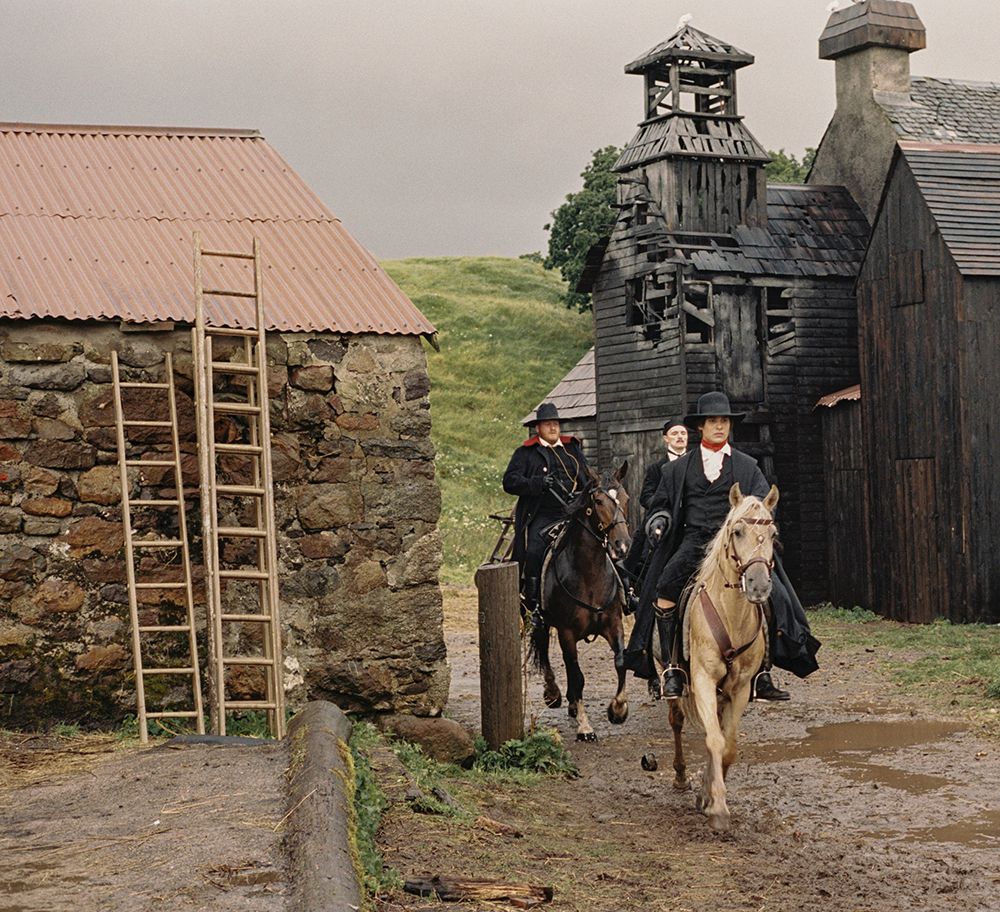 Master Jordan on horseback with his employees